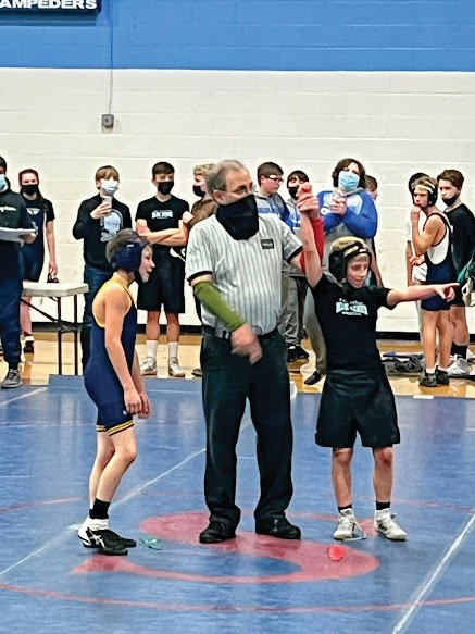 George Jordan, a Chimacum seventh-grader, defeated his Forks opponent last Wednesday as 10 or so of his teammates cheered him on in the background. After two weeks of competition, George is 2-2 on the season in his first year of wrestling.